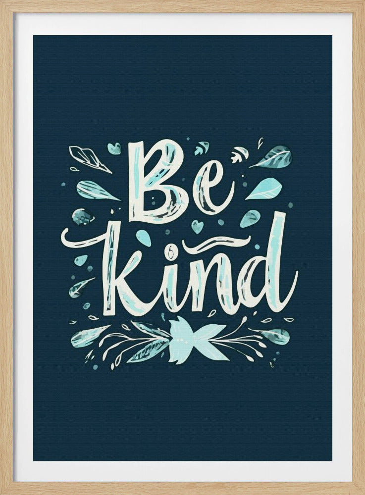 An inspirational art print with a dark blue background featuring the phrase 'Be Kind' in a stylized, hand-lettered white and light blue font. The text is decorated with small leaves, hearts, and flourishes in shades of teal and white. Artwork