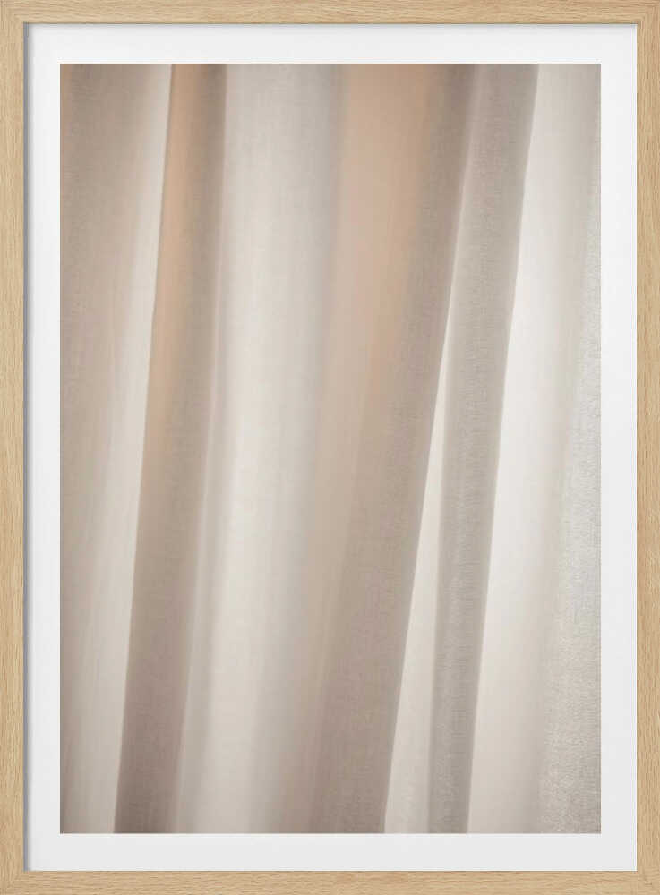 Abstract photo of light beige fabric with soft, flowing folds creating gentle shadows.