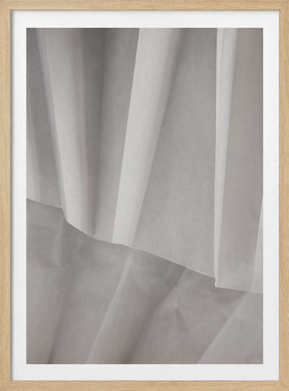 Abstract art print of folded white fabric or paper creating soft lines and deep shadows.
