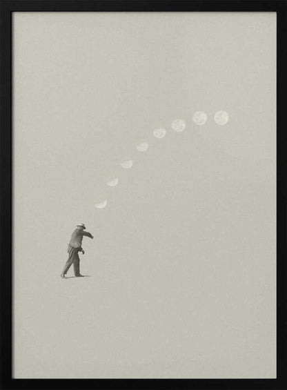 A man tosses the phases of the moon into the sky in a surreal, minimalist art piece.