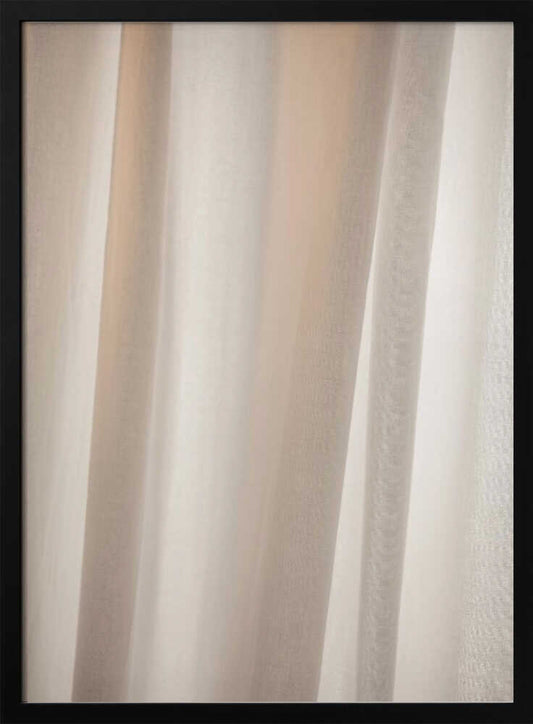 Abstract photo of light beige fabric with soft, flowing folds creating gentle shadows.