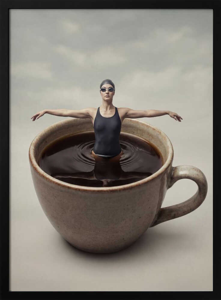 Surreal art print of a woman in a swimsuit swimming in a giant cup of coffee.