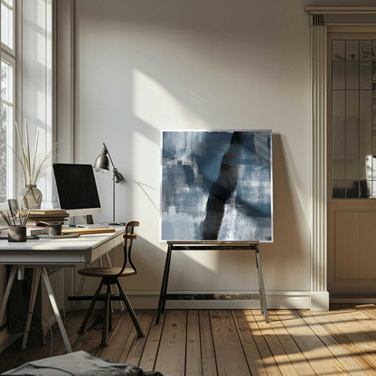 Abstract painting with bold blue, grey, and black brushstrokes in a light wood frame.