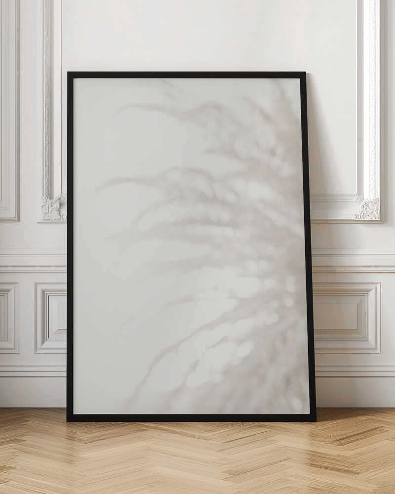 Soft focus photograph of a plant shadow on a light wall. Abstract and calming beige wall art with a minimalist feel.