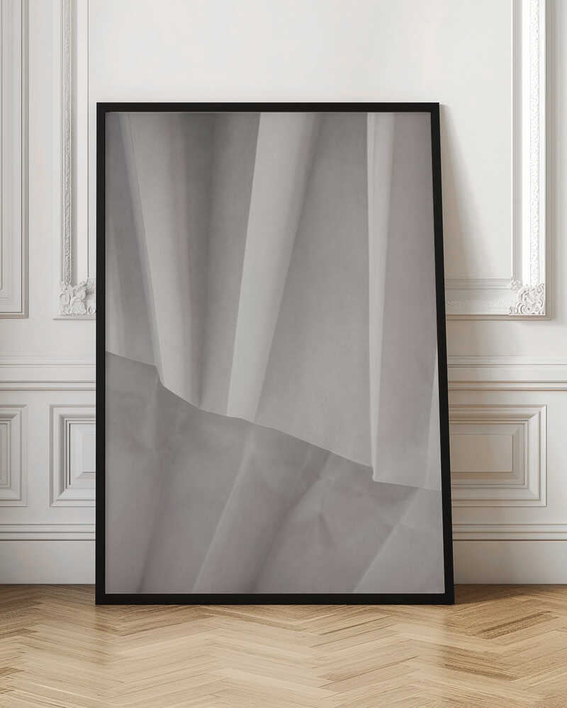 Abstract art print of folded white fabric or paper creating soft lines and deep shadows.