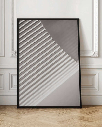 Abstract photograph of a ribbed surface with diagonal lines created by light and shadow, minimalist wall art.