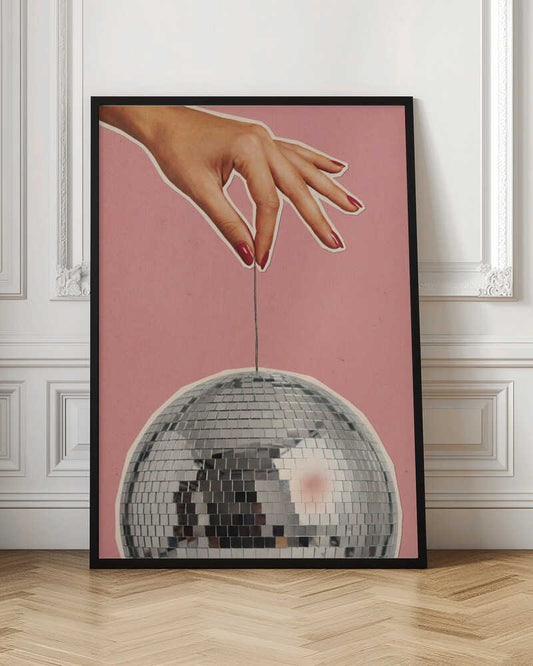 Retro collage art of a hand with red nails holding a silver disco ball against a pink background.