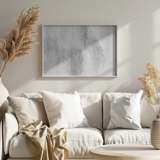 Abstract art with soft, cloud-like shapes in shades of grey and white, set in a silver frame.